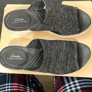 Clarks Cloudsteppers wedgie sandal.  My mother only wore them once. S